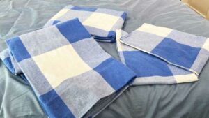 A set of Brooklinen Brushed Flannel sheets sits on a bed