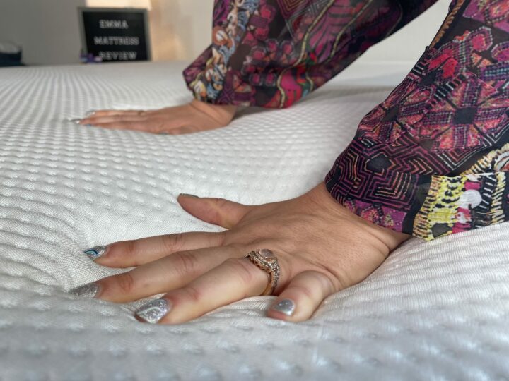 a woman presses into the Emma mattress