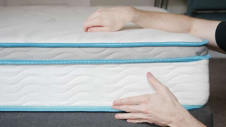 The side of a hybrid mattress.
