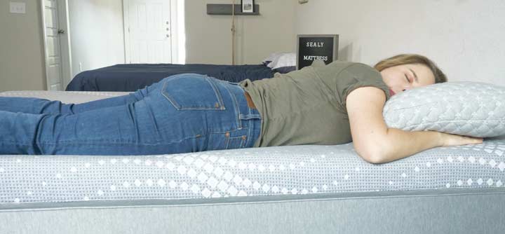 a woman sleeps on the Posturepedic mattress